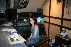 Dr. Lisajean, in from San Diego, listening to a mix of her band in my studio.